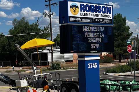 The new marquee with a yellow umbrella and other construction tools around it